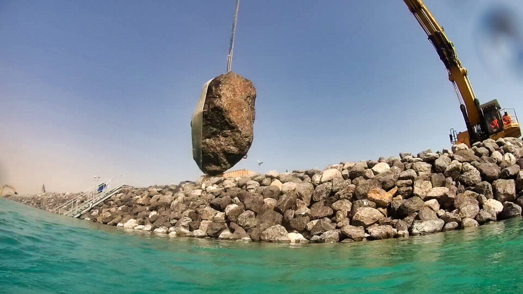 Diver removing an obstructing rock before CORELOC™ unit installation in Al Zour, Kuwait under CLAS supervision